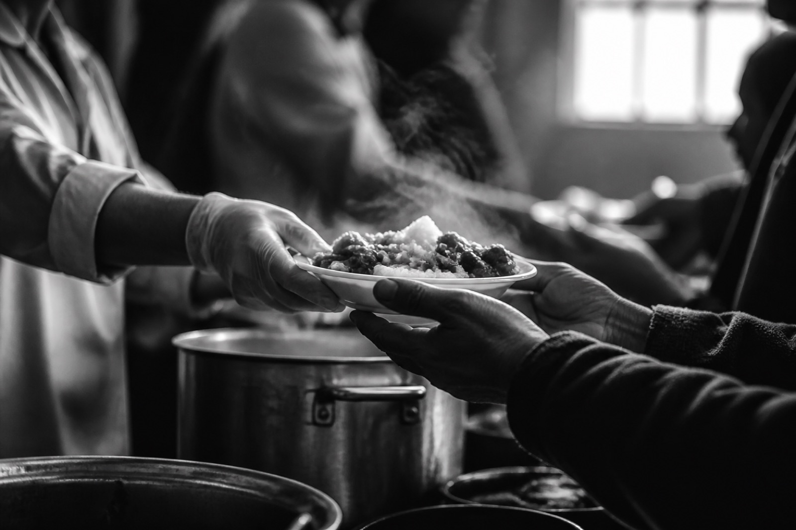 A warm meal passed from hand to hand
